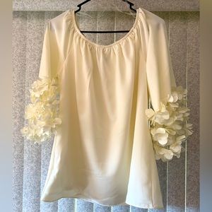 Prelude Ivory blouse with see through bell sleeves with flowers on them. Size L